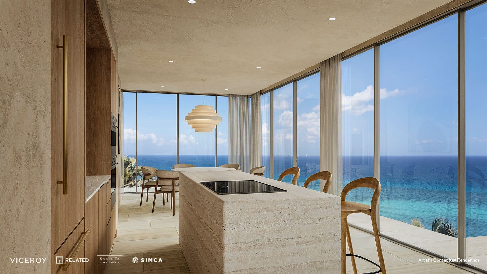 Open kitchen with travertine-tone island facing full-height ocean views.